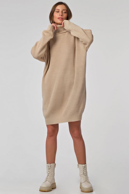 Warm knitted sweater dress with short cream color