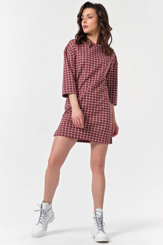 Short plaid knitted dress on burgundy