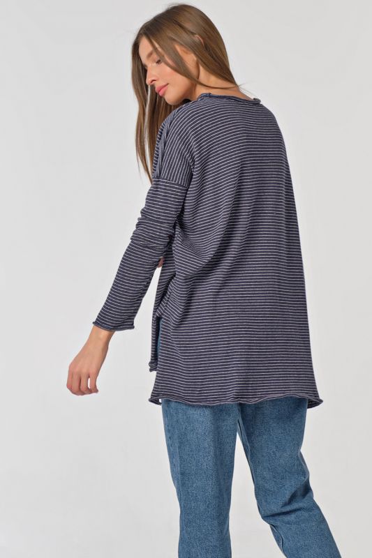 Oversize striped knit sweater on blue