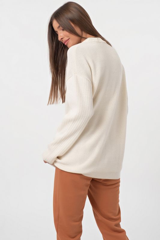 Long asymmetric warm asymmetrical knitted sweater in milk color