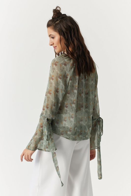 Transparent chiffon blouse with floral print on green