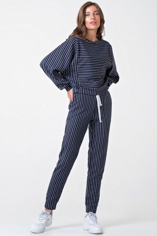 Casual suit with striped knitwear pants on navy blue