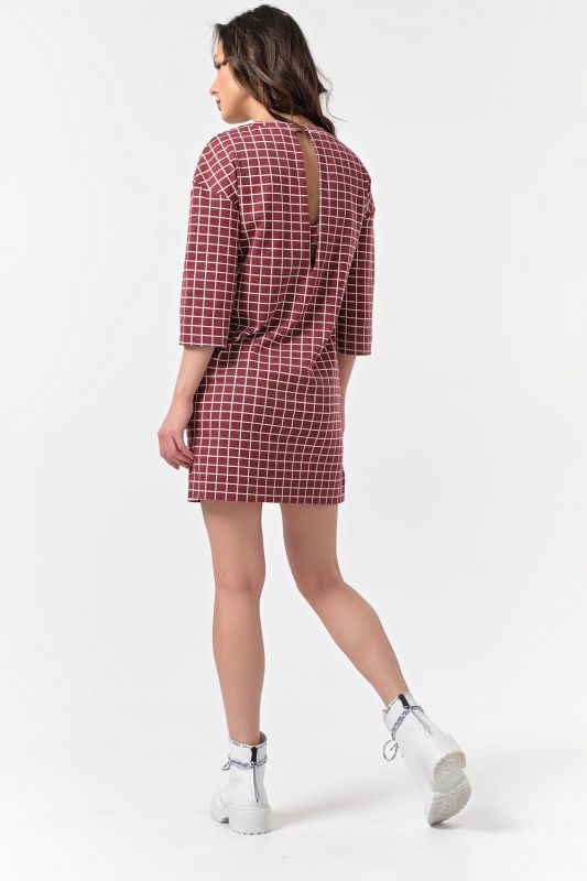 Short plaid knitted dress on burgundy