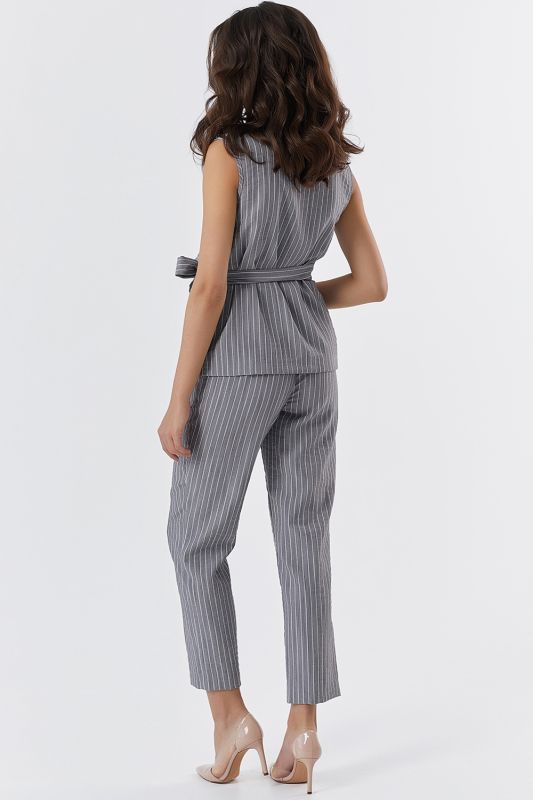 Summer pants suit with striped blouse on gray