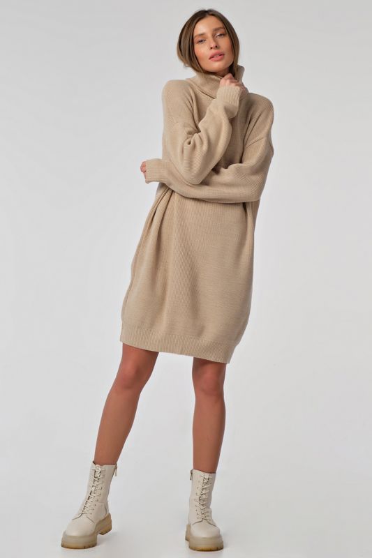 Warm knitted sweater dress with short cream color