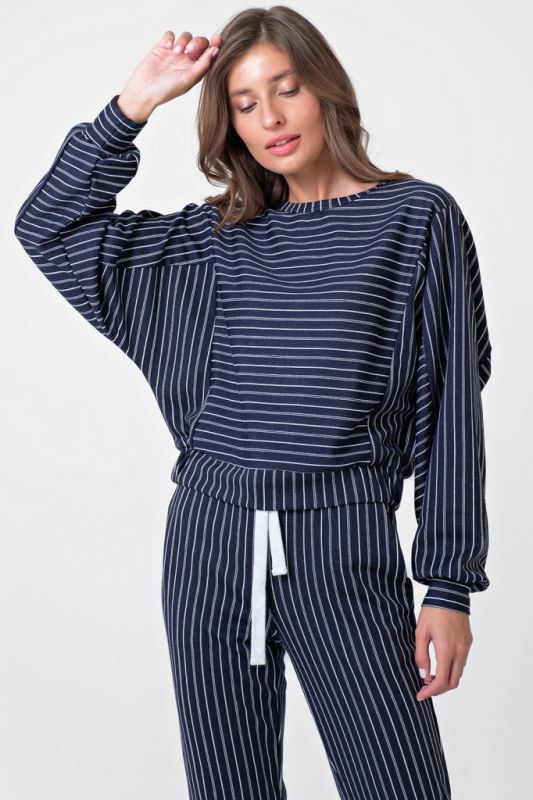 Casual suit with striped knitwear pants on navy blue