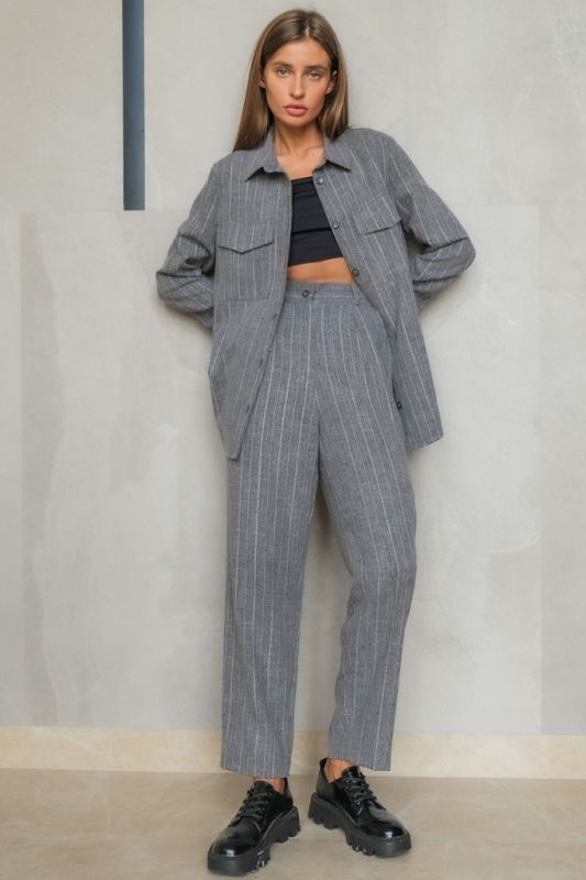 Oversize pants suit with striped shirt on gray