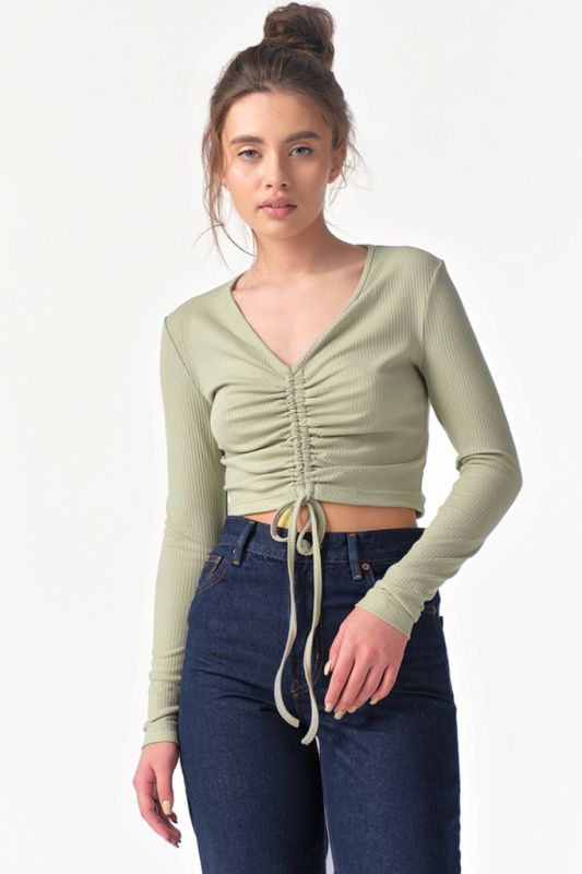 Long-sleeved knitted top with gathering at the front in green